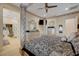 This main bedroom boasts a decorative canopy bed, ensuite bathroom, and modern design at 8 Reverie Heights Ave, Henderson, NV 89011