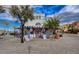 Charming outdoor cafe with purple accents, awning, and beautiful surrounding landscaping at 8 Reverie Heights Ave, Henderson, NV 89011