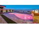 Beautiful backyard pool with multicolored lighting and a view of the Las Vegas valley at 8 Reverie Heights Ave, Henderson, NV 89011