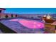 Beautiful backyard pool with custom lighting, waterfalls, and panoramic city views at 8 Reverie Heights Ave, Henderson, NV 89011