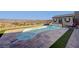 Swimming pool has lovely landscaping, a pool house, and fantastic views of the distant lake and hills at 8 Reverie Heights Ave, Henderson, NV 89011