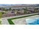 Beautiful pool with travertine pavers and partial views of the lake and mountains at 8 Reverie Heights Ave, Henderson, NV 89011