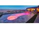 Beautiful backyard pool with multicolored lighting and a view of the Las Vegas valley at 8 Reverie Heights Ave, Henderson, NV 89011