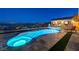 Enjoy the luxury of this unique pool, complete with a spa, waterfall feature, and stunning city views at 8 Reverie Heights Ave, Henderson, NV 89011