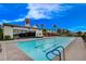 Lap pool with marked lanes and bright blue water alongside a modern building at 8 Reverie Heights Ave, Henderson, NV 89011