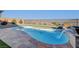 Refreshing swimming pool with a scenic view, waterfall feature, and elegant stone surround at 8 Reverie Heights Ave, Henderson, NV 89011