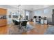 Dining room with wood floors, a modern light fixture, and a workstation at 8036 Eurostar St, Las Vegas, NV 89131