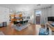 Dining area with wood floors, modern lighting, and adjacent kitchen and workstation at 8036 Eurostar St, Las Vegas, NV 89131