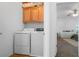 Convenient laundry room with front loading washer and dryer and wood-look floors at 8036 Eurostar St, Las Vegas, NV 89131