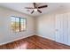 Bedroom featuring hardwood floors and a window at 8045 Sundance Valley Dr, Las Vegas, NV 89178