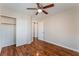 Bedroom featuring hardwood floors, ceiling fan, and closet at 8045 Sundance Valley Dr, Las Vegas, NV 89178