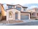 Charming two-story home with a two-car garage and desert landscaping in a residential neighborhood at 8045 Sundance Valley Dr, Las Vegas, NV 89178