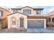 Charming two-story home with a two-car garage and desert landscaping in a residential neighborhood at 8045 Sundance Valley Dr, Las Vegas, NV 89178