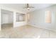 Spacious living room featuring tile floors, neutral walls, a ceiling fan, and an open layout at 8045 Sundance Valley Dr, Las Vegas, NV 89178