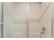 Bathroom shower with sliding glass doors and white tile at 8045 Sundance Valley Dr, Las Vegas, NV 89178