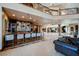 Basement bar area featuring bar seating, wet bar, and an open floor plan at 8280 Via Olivero Ave, Las Vegas, NV 89117