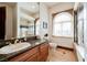 Bright bathroom features granite countertops, a vanity, and a separate shower at 8280 Via Olivero Ave, Las Vegas, NV 89117