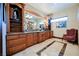 Bathroom boasts granite counters, custom wooden cabinets, and decorative tile flooring at 8280 Via Olivero Ave, Las Vegas, NV 89117