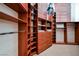 This custom closet features wood built-ins and drawers for optimal organization of all your apparel at 8280 Via Olivero Ave, Las Vegas, NV 89117