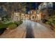 Grand entrance showcasing a long private driveway leading to the home, lined with palm trees at 8280 Via Olivero Ave, Las Vegas, NV 89117