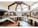 View of the foyer that features stone floors, high ceilings and a grand chandelier at 8280 Via Olivero Ave, Las Vegas, NV 89117