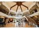 Impressive foyer with a dramatic chandelier, multiple levels, and staircase creating an open and grand space at 8280 Via Olivero Ave, Las Vegas, NV 89117