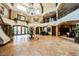 Spacious foyer with soaring ceilings, decorative columns, and a view of the upper level balconies at 8280 Via Olivero Ave, Las Vegas, NV 89117