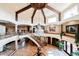 Shot of open floor plan and grand foyer featuring stone floors, columns and high ceilings at 8280 Via Olivero Ave, Las Vegas, NV 89117