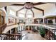 Staircase view displaying wrought iron rails, marble floors and wood beamed ceilings at 8280 Via Olivero Ave, Las Vegas, NV 89117