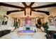 Large game room featuring a pool table, fireplace, and exposed beam ceiling at 8280 Via Olivero Ave, Las Vegas, NV 89117