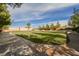 Lush community green space with walking path, mature trees, and plenty of room to play at 8280 Via Olivero Ave, Las Vegas, NV 89117