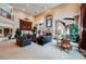 Spacious living room with high ceilings, large windows, and elegant decor at 8280 Via Olivero Ave, Las Vegas, NV 89117