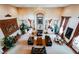 View of spacious living room boasting tall ceilings and centered fireplace with seating at 8280 Via Olivero Ave, Las Vegas, NV 89117