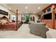 View of a large bedroom with a seating area and built-in entertainment center at 8280 Via Olivero Ave, Las Vegas, NV 89117