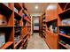 This walk-in pantry features abundant custom shelving for easy organization of food and kitchen appliances at 8280 Via Olivero Ave, Las Vegas, NV 89117