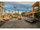 Beautiful outdoor living space showcasing a pool with rock features, lounge chairs, and desert landscaping at 8280 Via Olivero Ave, Las Vegas, NV 89117