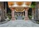 Impressive porte cochere with grand columns and manicured landscaping, creating a welcoming entrance at 8280 Via Olivero Ave, Las Vegas, NV 89117