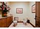 Elegant powder room with toilet, bidet, custom cabinet and floral arrangements at 8280 Via Olivero Ave, Las Vegas, NV 89117