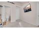 Bedroom featuring a door to a bathroom and a tv at 8426 Sluman Ct, Las Vegas, NV 89128