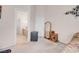 Neutral bedroom showcasing door to bath, standing mirror and modern wall art at 8426 Sluman Ct, Las Vegas, NV 89128