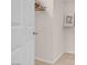 A white door leading to a walk-in closet with a door and wired shelving at 8426 Sluman Ct, Las Vegas, NV 89128