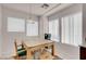 Bright dining area with lots of natural light from large windows, adjacent to the kitchen at 8426 Sluman Ct, Las Vegas, NV 89128