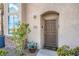 Close-up of townhouse front door, showcasing the entry and desert-friendly landscaping at 8426 Sluman Ct, Las Vegas, NV 89128