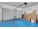 Spacious two car garage with painted floors; great potential for a workshop or storage area at 8426 Sluman Ct, Las Vegas, NV 89128