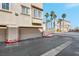 Tandem two-car garage showcasing a private entry point to the townhome at 8426 Sluman Ct, Las Vegas, NV 89128