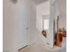 Well-lit hallway featuring carpet floors and an open doorway into a room at 8426 Sluman Ct, Las Vegas, NV 89128