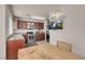 A modern kitchen with wooden cabinets, stainless steel appliances and eat-in breakfast nook at 8426 Sluman Ct, Las Vegas, NV 89128