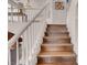 Bright staircase with wood treads and white risers leads to the upper level at 8426 Sluman Ct, Las Vegas, NV 89128