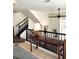 Second floor landing with a view of the living area, staircase, and a side table and lamp at 8426 Sluman Ct, Las Vegas, NV 89128