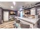 Entertainment room featuring a bar area with a large countertops, mini-fridge and TV sets at 8932 Beach Front Dr, Las Vegas, NV 89117